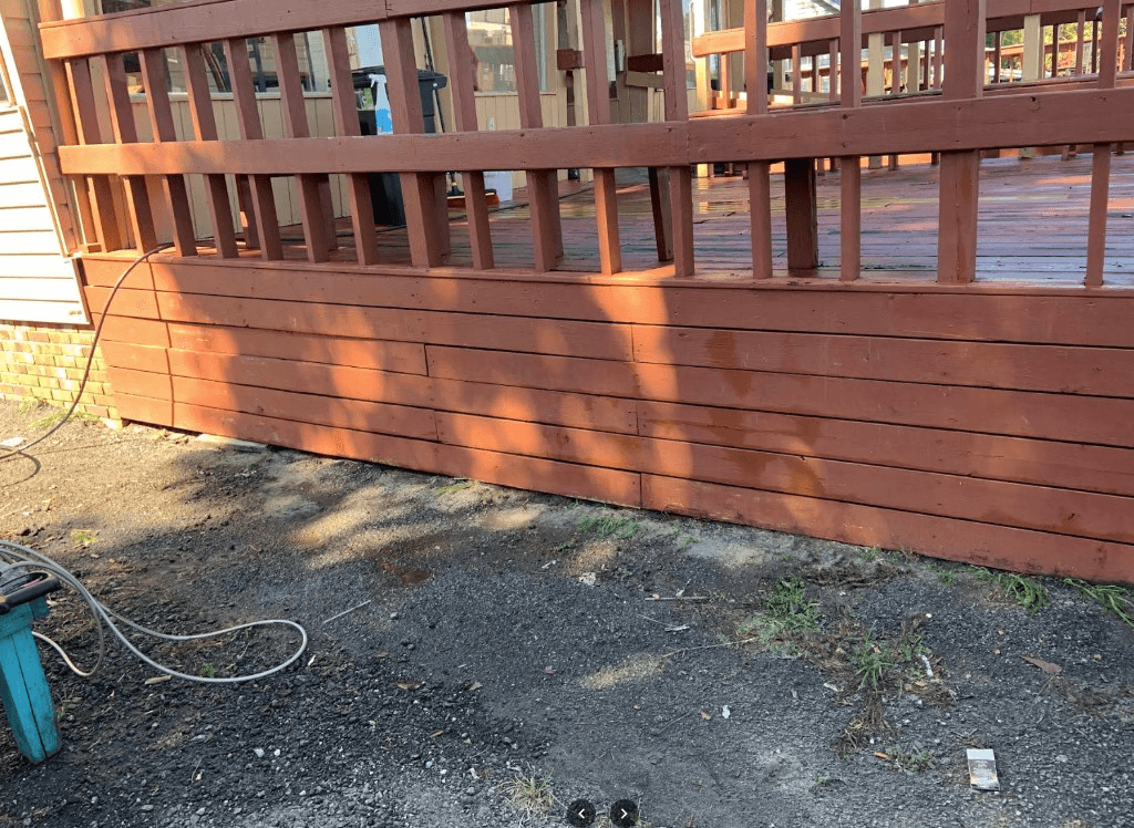 Freshly cleaned wooden deck after pressure washing